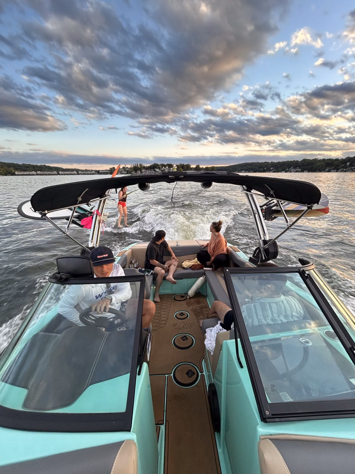Aboard the Wake Club wake boat at sunset on Lake Hopatcong
