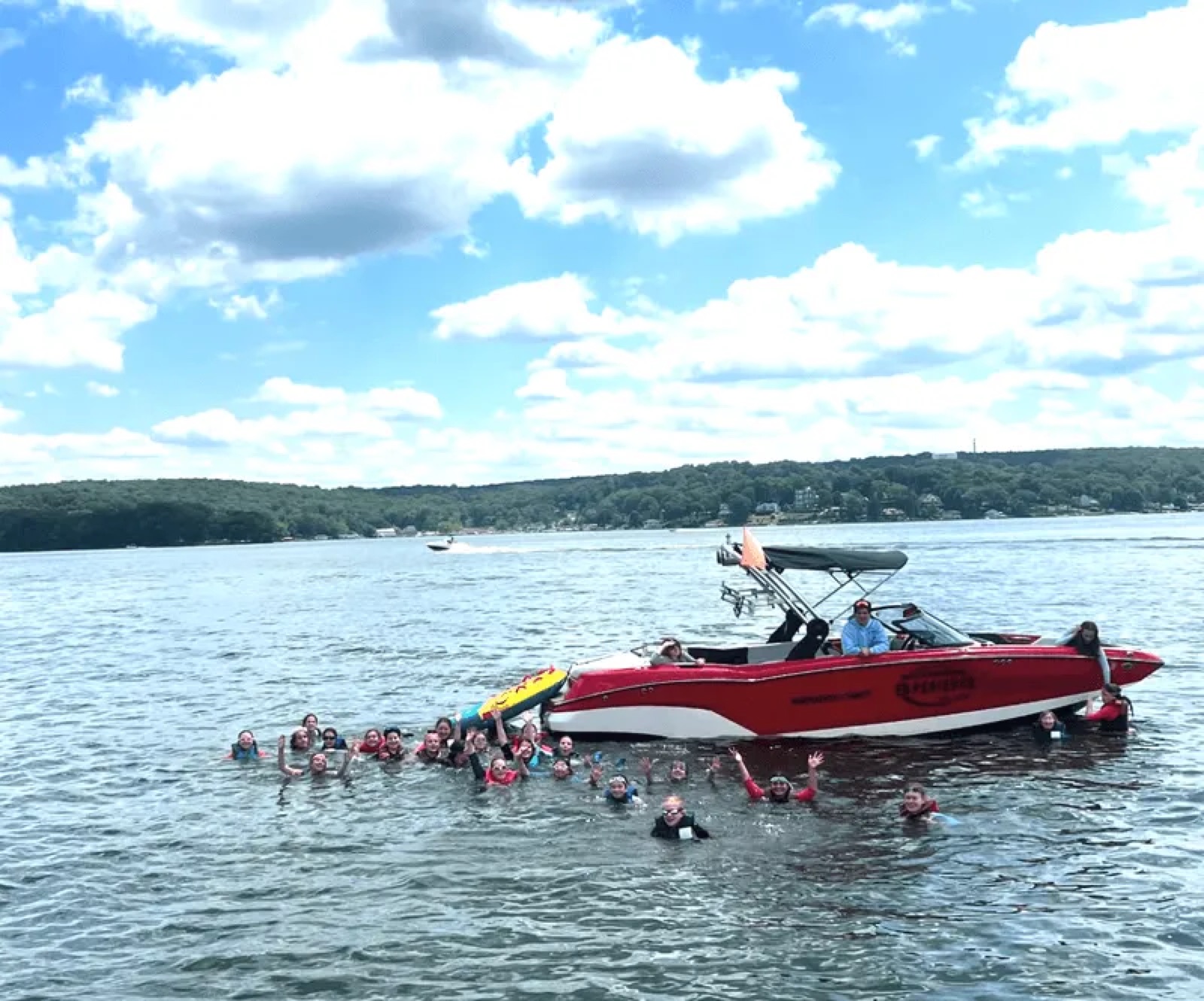 Wake boat on calm water
