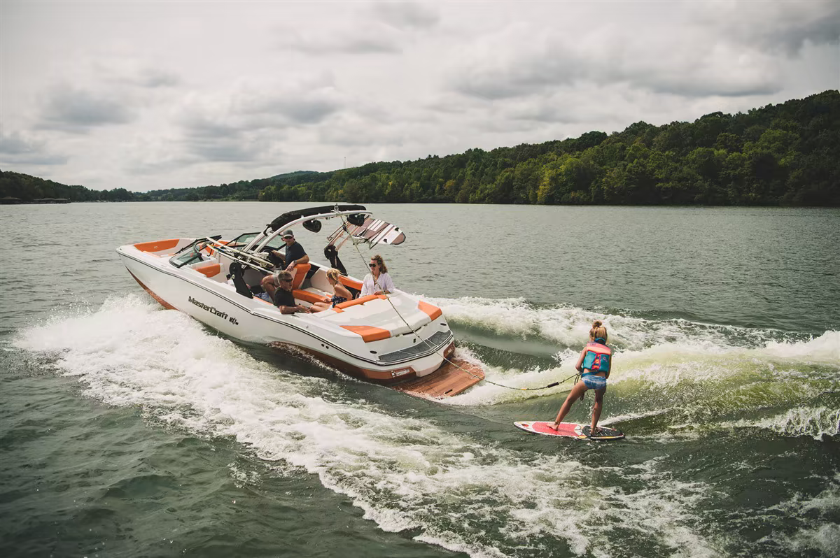 Red wake boat on the lake